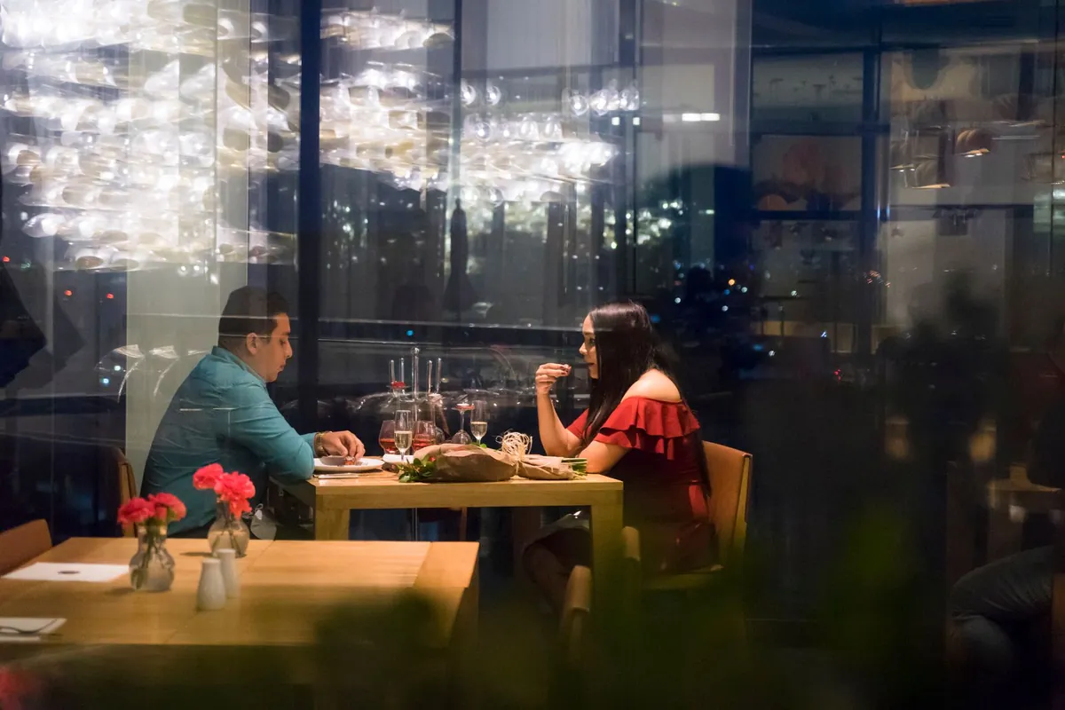 Guests enjoying a warm special-occasion dinner in a restaurant